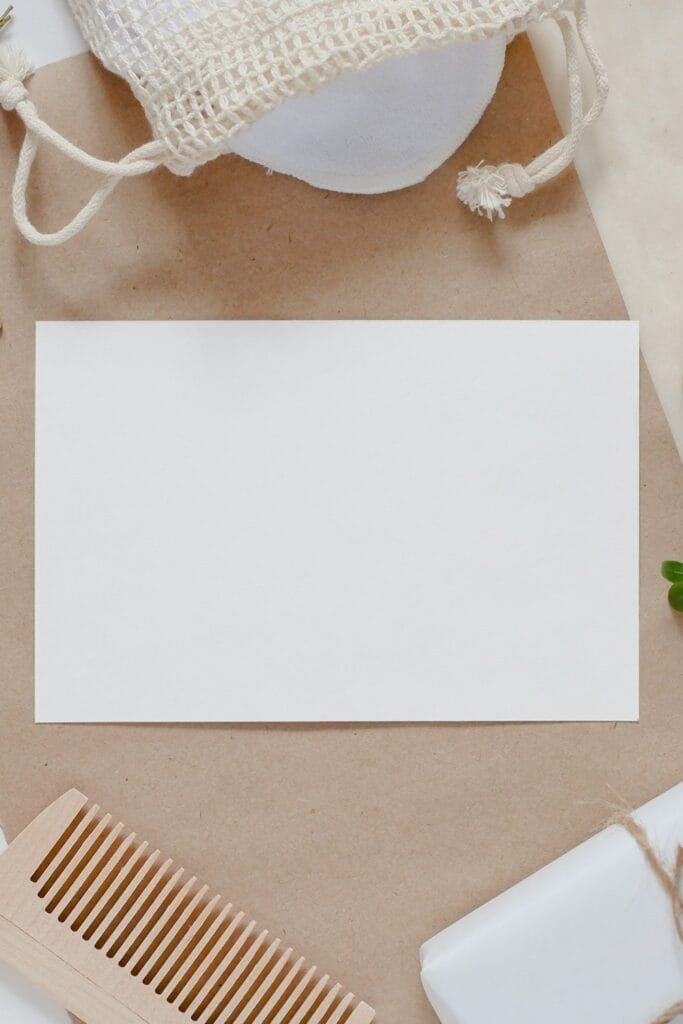 Reusable holiday gift wrapping supplies arranged on a wooden table